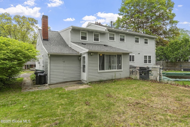 15 Oak Tree Ln, Colonie, NY 12309 - back of house featuring a chimney and roof with shingles
