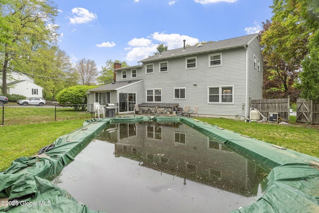 15 Oak Tree Ln, Colonie, NY 12309 - back of property featuring cooling unit and a chimney
