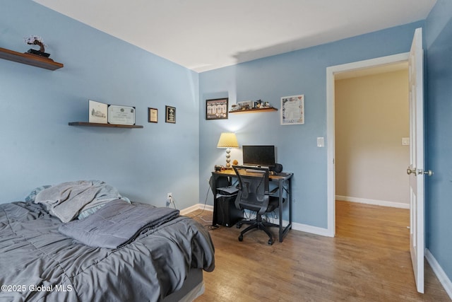 15 Oak Tree Ln, Colonie, NY 12309 - bedroom with wood finished floors, an office area, and baseboards