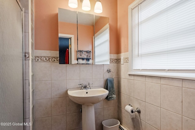 15 Oak Tree Ln, Colonie, NY 12309 - bathroom featuring tile walls, wainscoting, and an enclosed shower