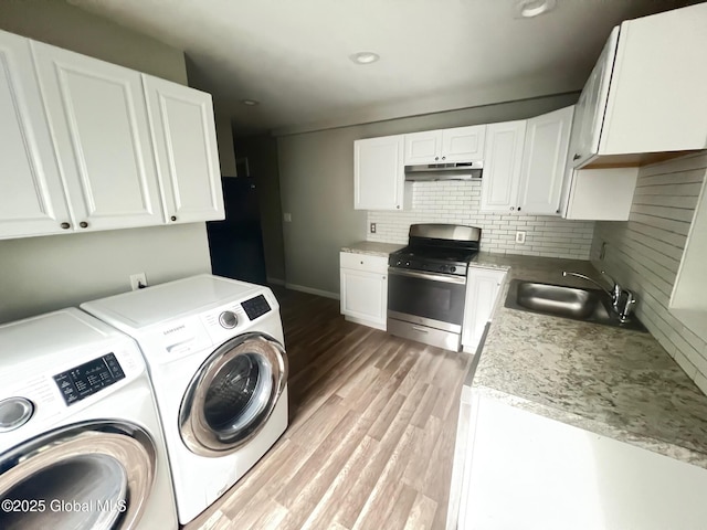 31-33 Malta Ave, Ballston Spa, NY 12020 - laundry area featuring washing machine and dryer, light wood-type flooring, baseboards, and recessed lighting