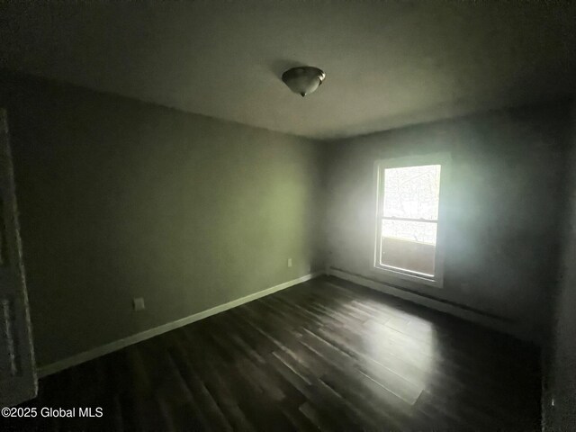 31-33 Malta Ave, Ballston Spa, NY 12020 - empty room featuring dark wood-style flooring and baseboards