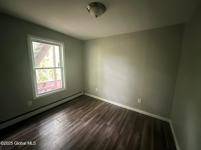 31-33 Malta Ave, Ballston Spa, NY 12020 - spare room with a baseboard radiator, dark wood-style floors, and baseboards