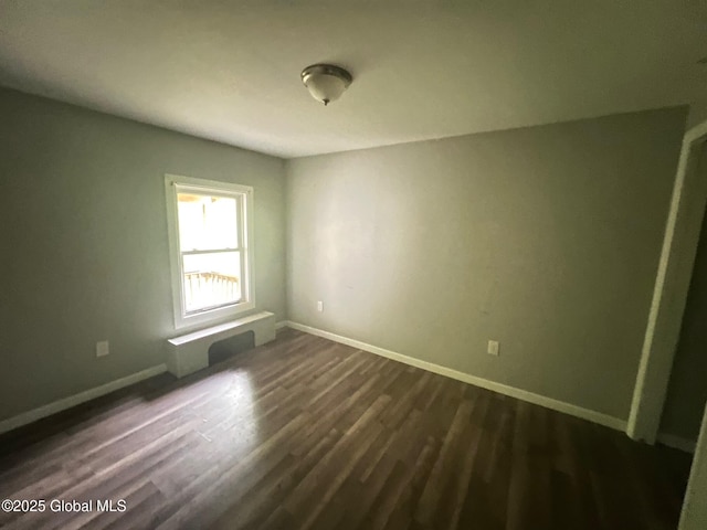 31-33 Malta Ave, Ballston Spa, NY 12020 - spare room featuring dark wood finished floors and baseboards