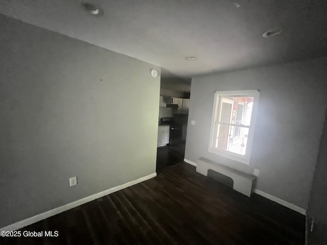 31-33 Malta Ave, Ballston Spa, NY 12020 - spare room with dark wood-style floors and baseboards