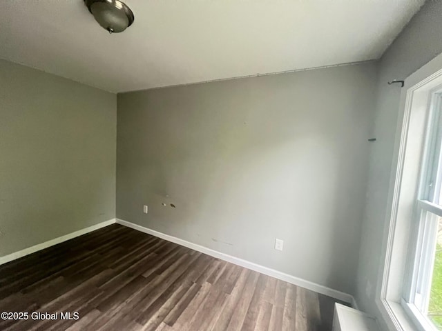 31-33 Malta Ave, Ballston Spa, NY 12020 - unfurnished room with dark wood-type flooring and baseboards