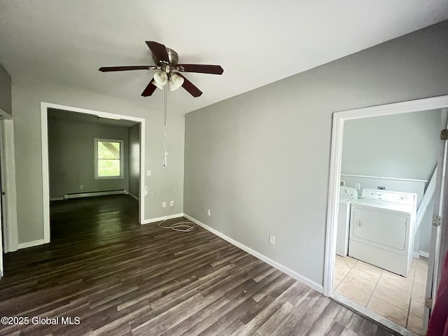31-33 Malta Ave, Ballston Spa, NY 12020 - empty room with washer and clothes dryer, a baseboard heating unit, ceiling fan, wood finished floors, and baseboards