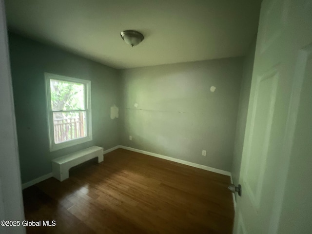 31-33 Malta Ave, Ballston Spa, NY 12020 - unfurnished room featuring dark wood-type flooring and baseboards