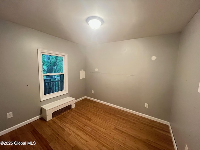 31-33 Malta Ave, Ballston Spa, NY 12020 - spare room featuring wood finished floors and baseboards