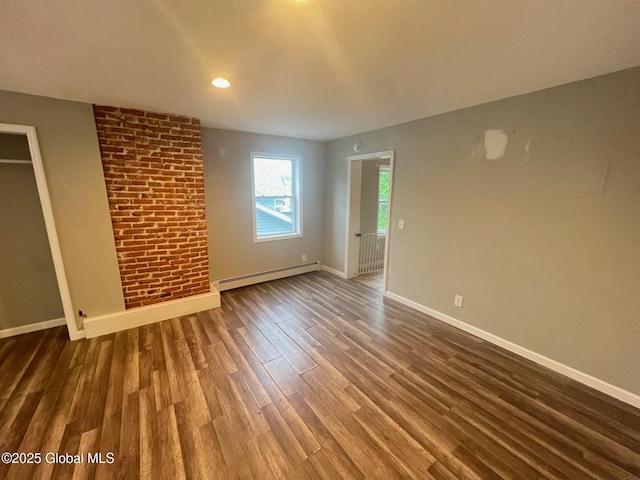 31-33 Malta Ave, Ballston Spa, NY 12020 - unfurnished living room featuring a baseboard heating unit, wood finished floors, baseboards, and recessed lighting