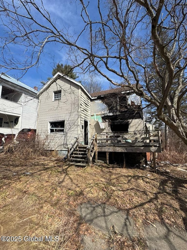 view of property exterior featuring a deck