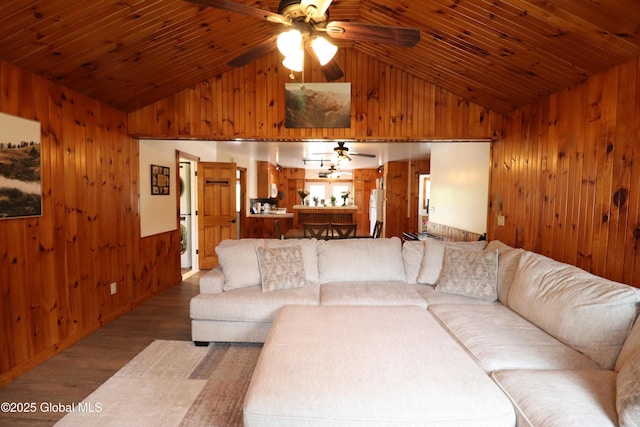 11 Filkins Ln, Voorheesville, NY 12186 - living room with wood walls, lofted ceiling, ceiling fan, wood finished floors, and wood ceiling