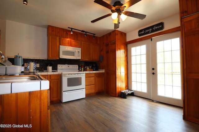11 Filkins Ln, Voorheesville, NY 12186 - kitchen featuring white appliances, track lighting, tile counters, tasteful backsplash, and a sink