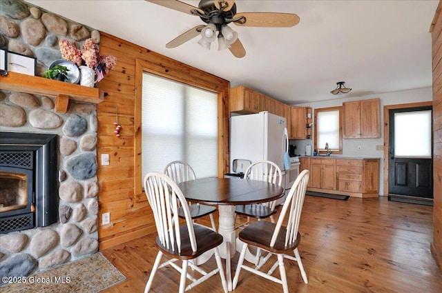 126 Lakeview Ln, Mayfield, NY 12117 - dining room featuring ceiling fan, light wood-style floors, and wooden walls