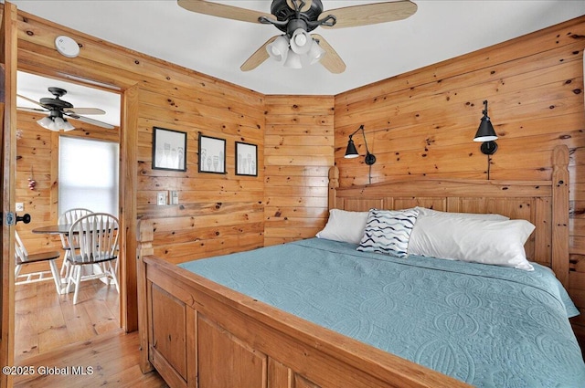 126 Lakeview Ln, Mayfield, NY 12117 - bedroom featuring light wood-style floors, wood walls, and ceiling fan