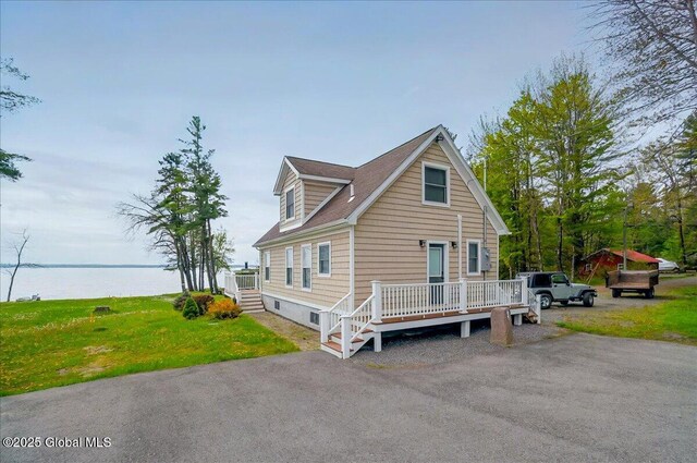 126 Lakeview Ln, Mayfield, NY 12117 - view of front facade with a deck with water view and a front yard