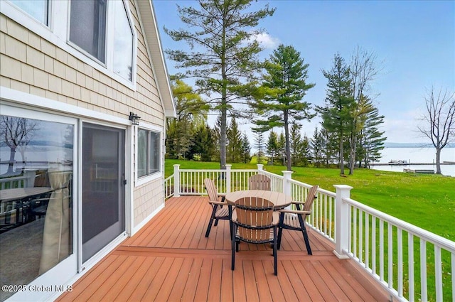 126 Lakeview Ln, Mayfield, NY 12117 - wooden deck featuring outdoor dining area, a water view, and a lawn