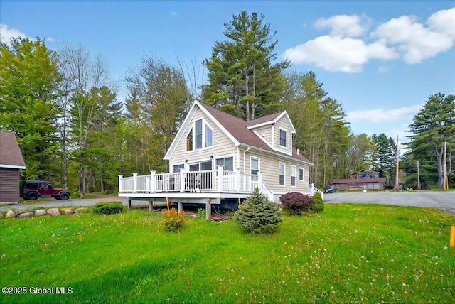 126 Lakeview Ln, Mayfield, NY 12117 - rear view of property featuring a wooden deck, a yard, and view of wooded area
