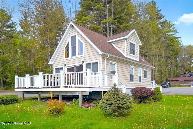 126 Lakeview Ln, Mayfield, NY 12117 - view of home's exterior featuring a deck, roof with shingles, and a yard