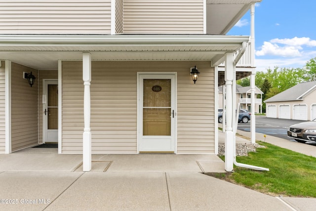 doorway to property featuring covered porch