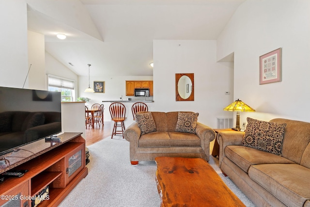 living area with lofted ceiling