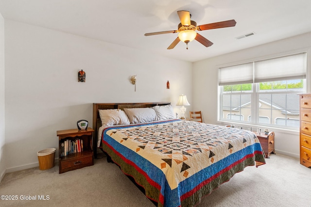 bedroom with carpet floors, baseboards, and ceiling fan