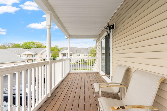 wooden deck featuring a residential view