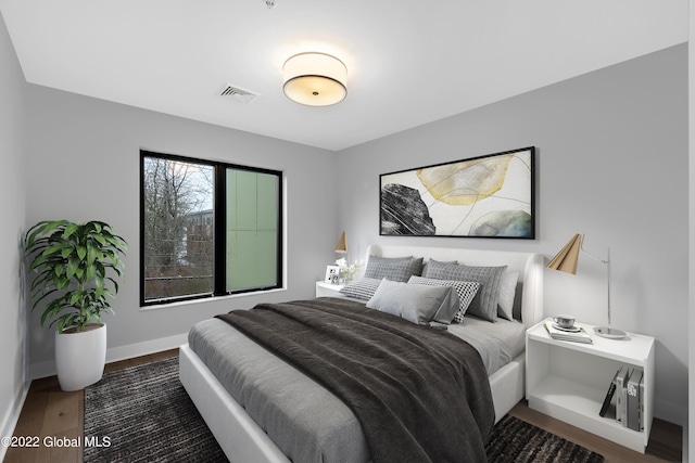 116 W Ave Unit 309, Saratoga Springs, NY 12866 - bedroom featuring wood finished floors and baseboards