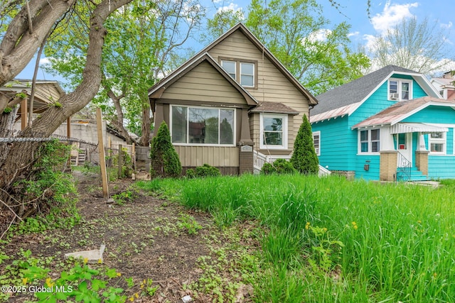 back of property with fence