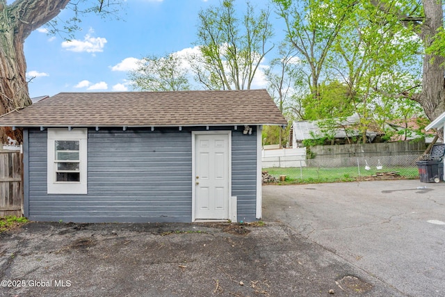 view of shed with fence