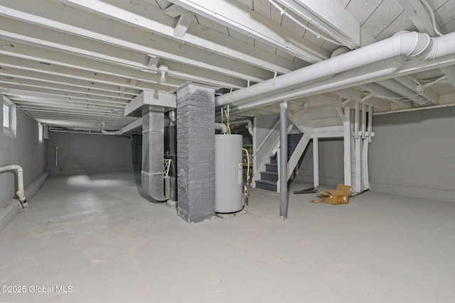 unfinished basement featuring water heater and heating unit