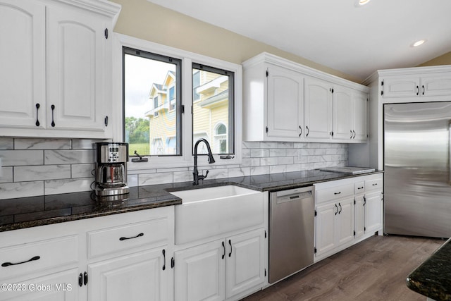 6510 State Route 10, Seward, NY 13459 - kitchen with stainless steel appliances, white cabinetry, dark wood-type flooring, a sink, and recessed lighting