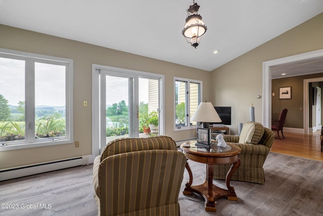 6510 State Route 10, Seward, NY 13459 - sitting room featuring vaulted ceiling, healthy amount of natural light, wood finished floors, baseboard heating, and recessed lighting