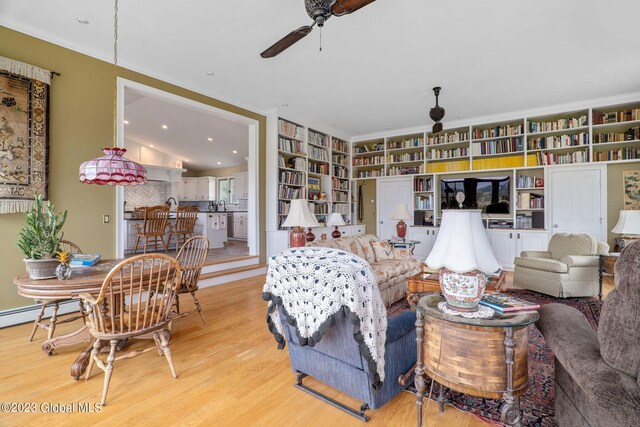 6510 State Route 10, Seward, NY 13459 - living room featuring wood finished floors, ceiling fan, and built in features