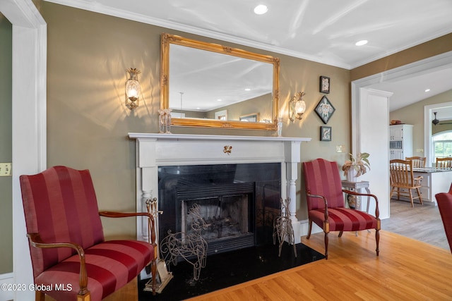 6510 State Route 10, Seward, NY 13459 - sitting room with wood finished floors, a fireplace with flush hearth, crown molding, and recessed lighting