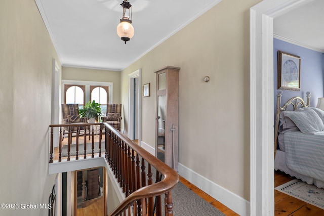 6510 State Route 10, Seward, NY 13459 - corridor featuring wood finished floors, ornamental molding, an upstairs landing, and baseboards