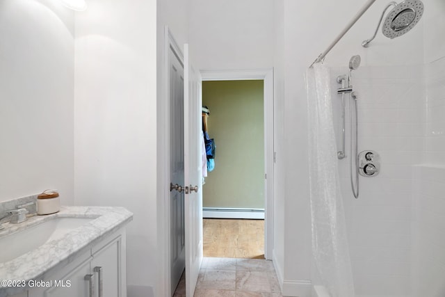 6510 State Route 10, Seward, NY 13459 - full bathroom with tiled shower, a baseboard radiator, and vanity