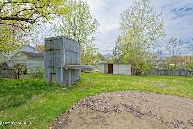 view of yard with a storage unit and an outdoor structure