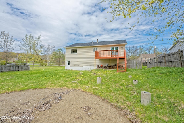 rear view of house featuring a wooden deck