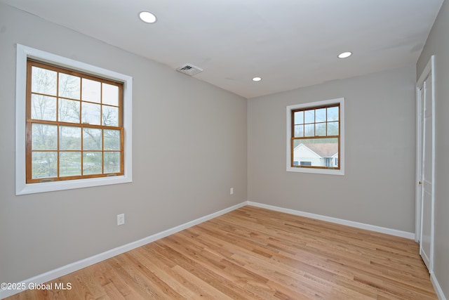 unfurnished bedroom with baseboards, light wood-style flooring, and recessed lighting