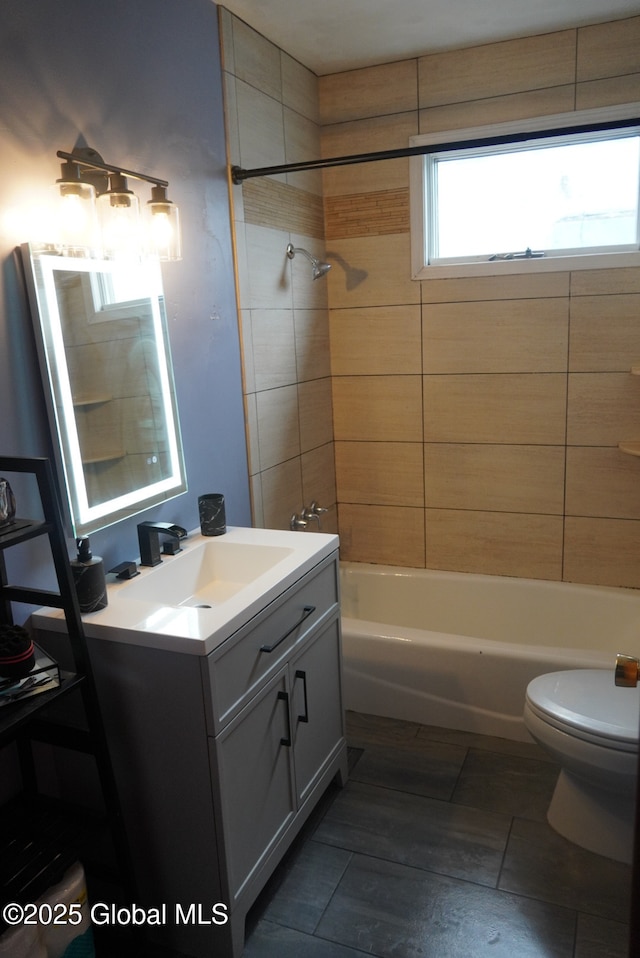 full bath featuring toilet, tub / shower combination, and vanity