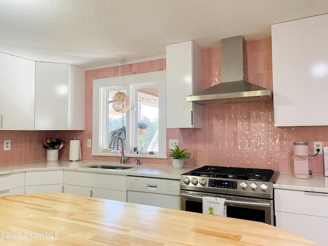 5 Moon Dr, Saratoga Springs, Inside, NY 12866 - kitchen with wall chimney range hood, stainless steel gas range oven, a sink, white dishwasher, and wooden counters