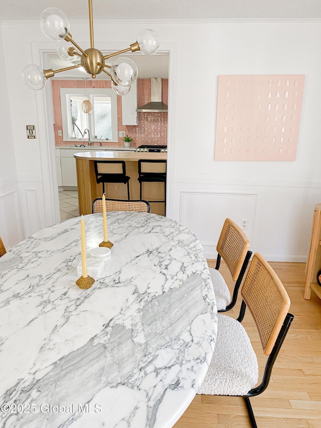 5 Moon Dr, Saratoga Springs, Inside, NY 12866 - dining area featuring light wood-style floors and wainscoting