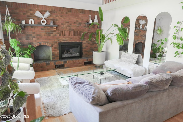 5 Moon Dr, Saratoga Springs, Inside, NY 12866 - living area featuring a brick fireplace and wood finished floors
