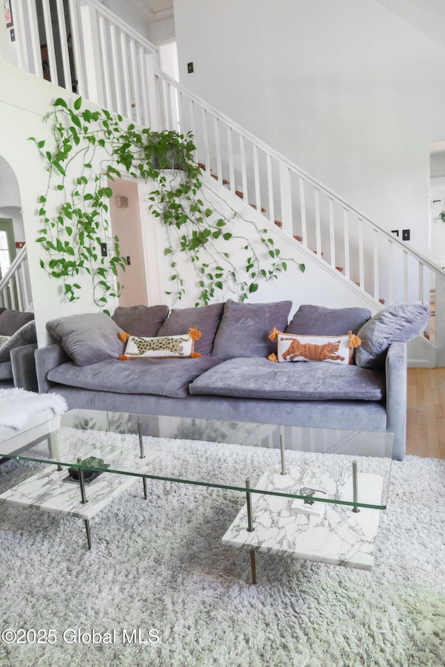 5 Moon Dr, Saratoga Springs, Inside, NY 12866 - living room featuring wood finished floors, stairs, and arched walkways