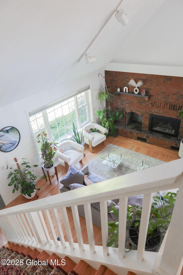 5 Moon Dr, Saratoga Springs, Inside, NY 12866 - living room featuring rail lighting and a brick fireplace