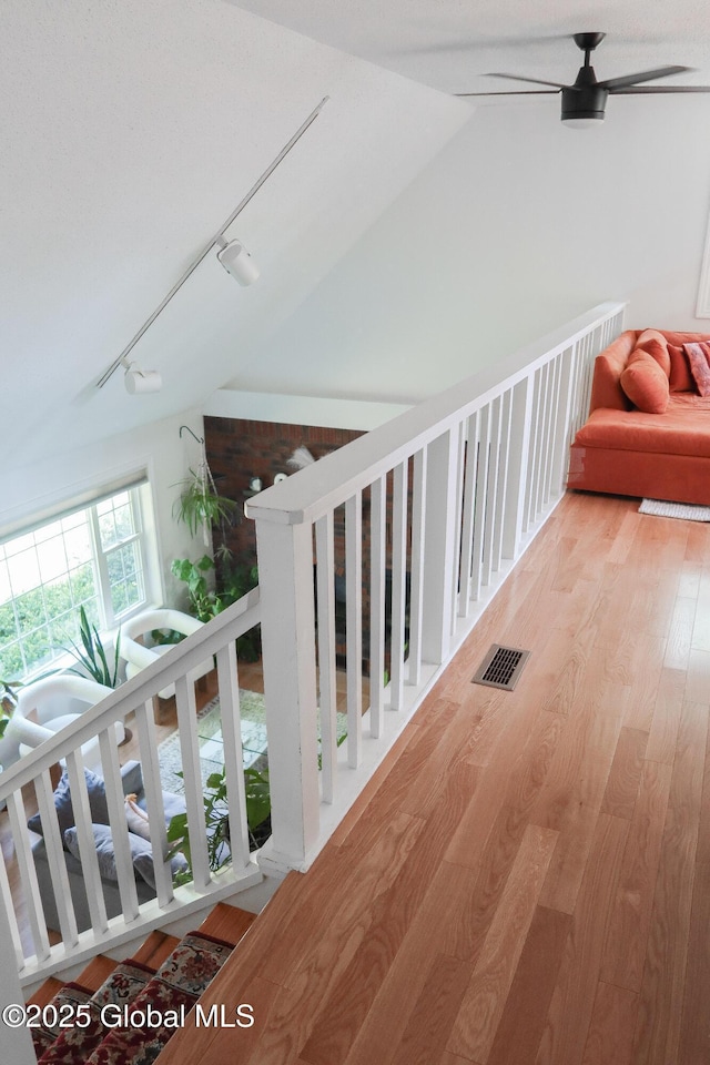 5 Moon Dr, Saratoga Springs, Inside, NY 12866 - corridor featuring vaulted ceiling, wood finished floors, and rail lighting