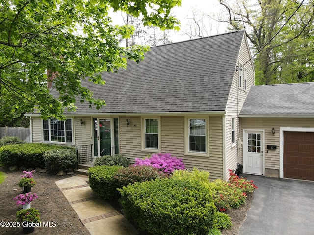 5 Moon Dr, Saratoga Springs, Inside, NY 12866 - cape cod house with a shingled roof, an attached garage, and driveway