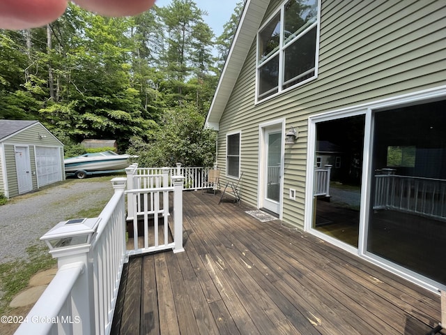 166 Finkle Rd, Bolton, NY 12814 - deck with a garage and an outbuilding