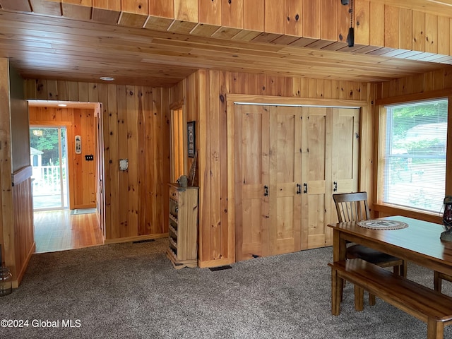166 Finkle Rd, Bolton, NY 12814 - carpeted dining room featuring wooden ceiling and wood walls